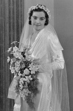 My mother on her wedding day - formal studio
                    portrait. Jennifer Cram Marriage Celebrant