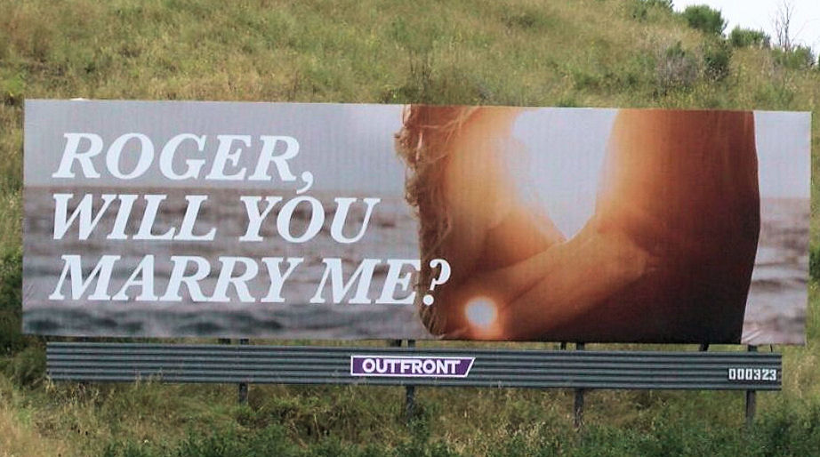 Billboard saying Roger, will you marry
                      me>