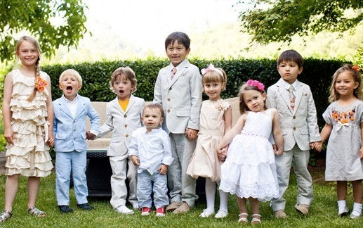 Group of children of assorted ages dressed in
                    their best