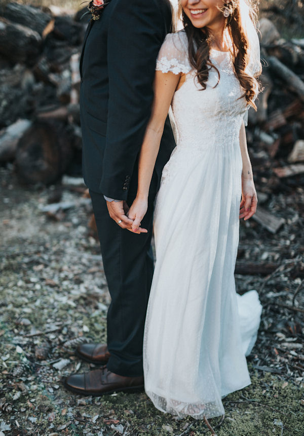 Bride and Groom standing back to
                              back