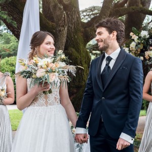 Bride and
                      Groom holding hands.