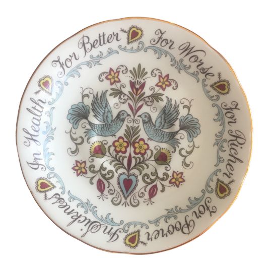 Bone China saucer that has the words
                              For Better For Worse In Sickness In Health
                              round the rim and an illustration of two
                              blue birds in the centre together with
                              stylised floral elements