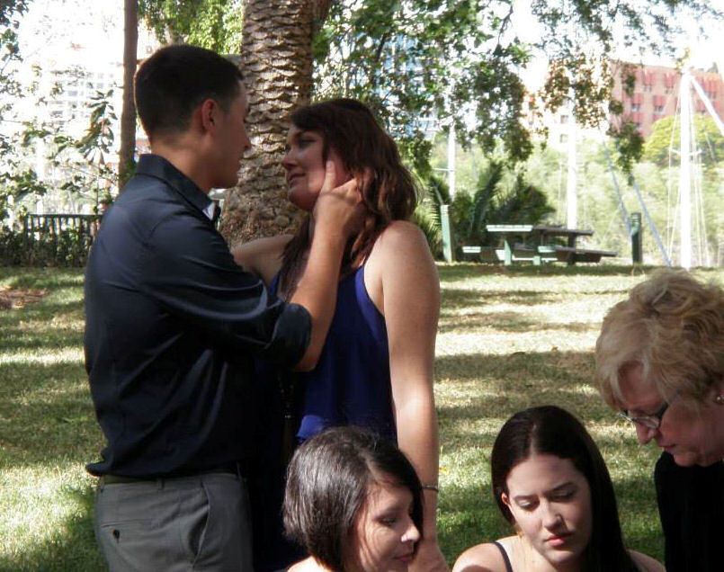 Emma and Sean share a private moment while
                    their witnesses are signing the Register after their
                    marriage by Jennifer Cram, Brisbane Wedding
                    Celebrant